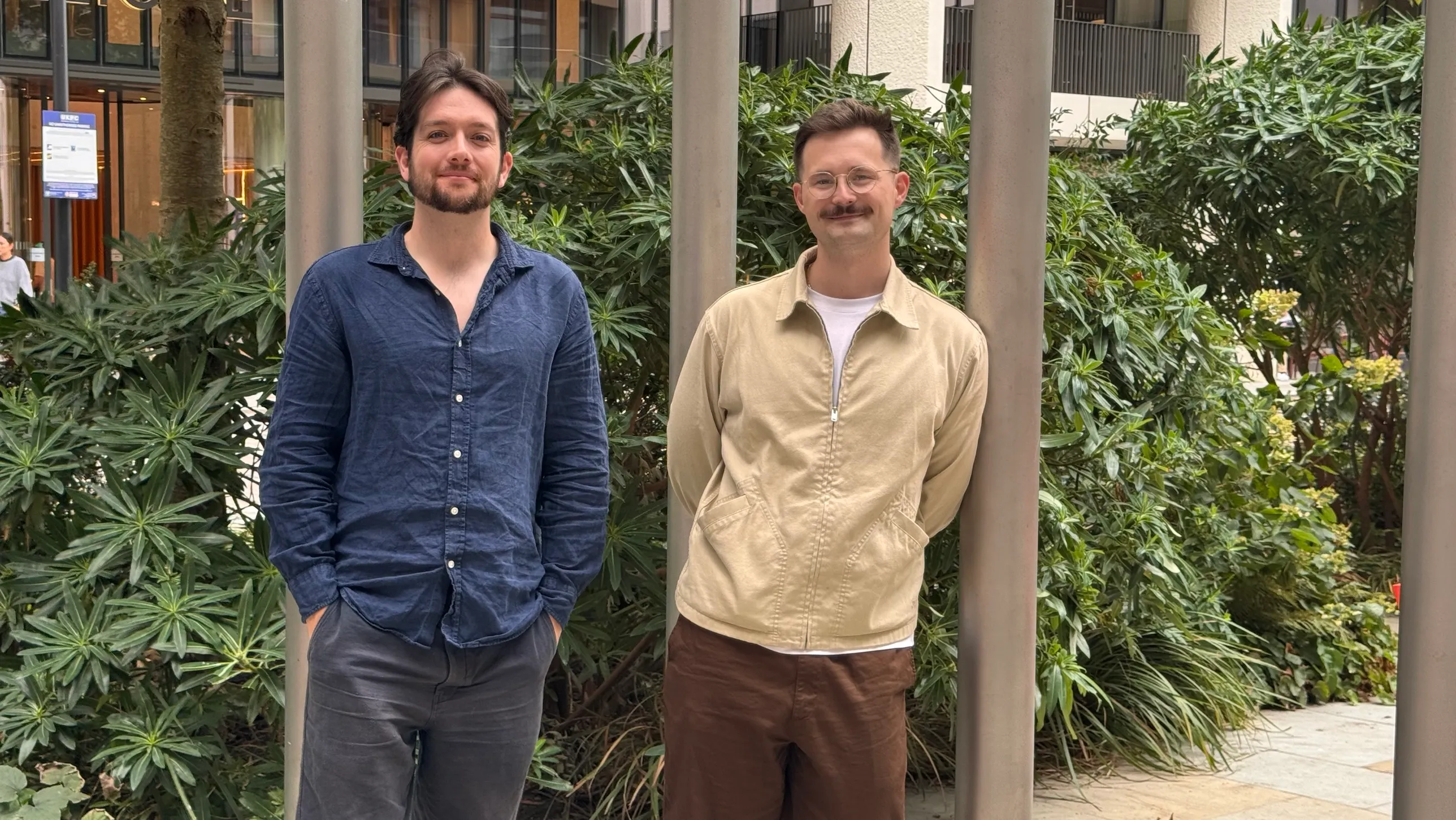 Hayden, left, and Frazer, right, the co-founders of Doris, outside in a courtyard.